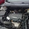 A car engine with the hood open.