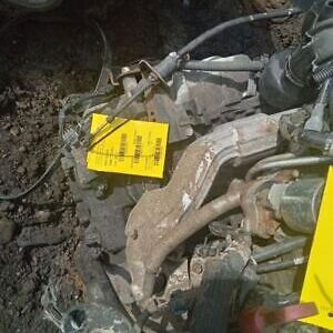 A pile of debris with a yellow sign on it.