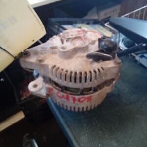 A close up of an old car alternator