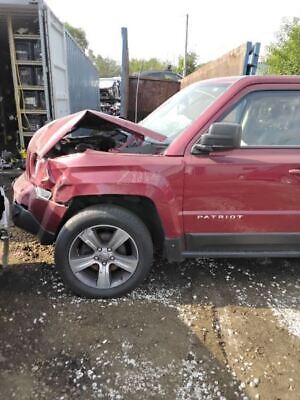 A red truck with its hood up and the front end of it.