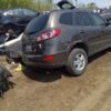 A car that is sitting in the dirt.