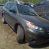 A car that is parked in the dirt.