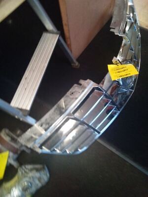 A metal piece of art with yellow tags on it.