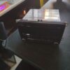 A black table with a black and silver box on it