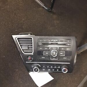 A car radio is shown with the buttons on it.