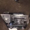 A car stereo with the radio and other items on it.