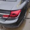 A car that is sitting in the mud.