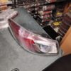 A car 's tail light is shown in the middle of a store.