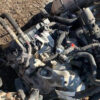 A pile of old parts sitting on top of the ground.