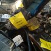A pile of metal with yellow tags on it.