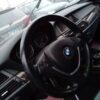 A car is shown with the steering wheel turned to the left.