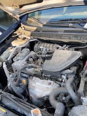 A car engine with the hood open.