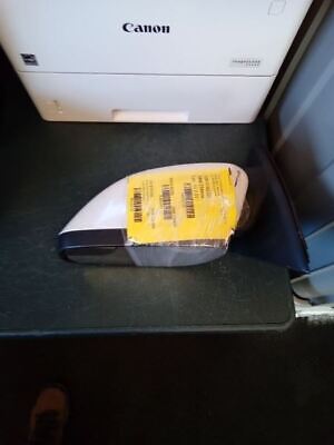 A piece of luggage on the ground next to an open printer.