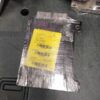 A package of aluminum foil wrapped around the back of a car.