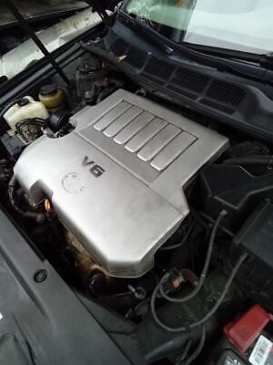 A car engine with the lid open.