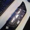 A car 's headlight is shown on the table.
