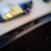 A blurry picture of a table with a yellow and black object.