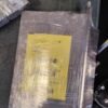 A package of yellow paper wrapped in plastic.