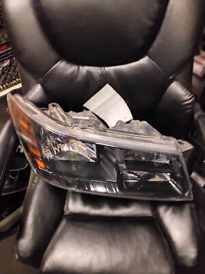 A black leather chair with a car headlight on it