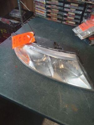 A car headlight with an orange tag on it.