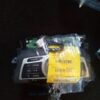 A car radio with some wires and other items