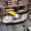A car headlight sitting on top of a table.