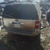 A van that is sitting in the dirt.