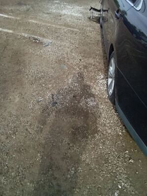 A black car parked in the parking lot with its front tire on.