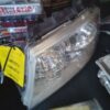 A car headlight sitting on top of a table.