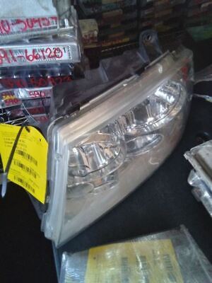 A car headlight sitting on top of a table.
