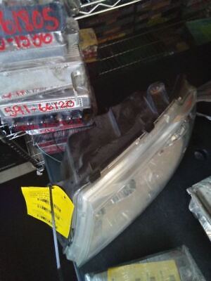 A plastic container with some dvd 's on top of it