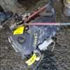 A broken car engine with the number 2 4 8 9 7 on it.
