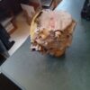 A picture of an old car engine on the table.