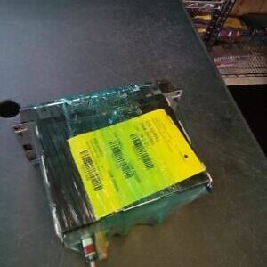 A yellow piece of glass sitting on top of a table.