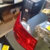 A red tail light sitting on top of a table.