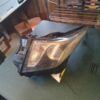 A car headlight sitting on top of a table.