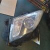 A car headlight sitting on top of a table.