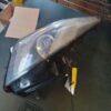 A car headlight with the side of it on top of a table.