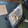 A car headlight with the lens missing.