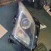 A car headlight with the lens missing.