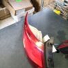A red tail light sitting on top of a table.