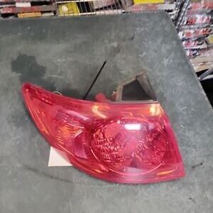 A red car 's tail light sitting on top of a table.