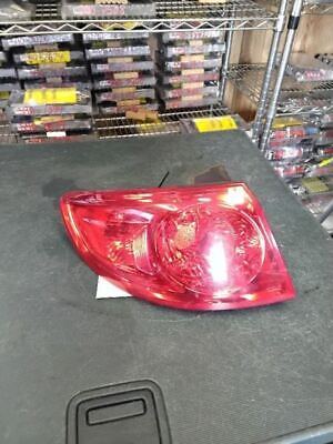 A red car tail light sitting on top of a table.