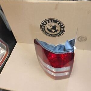 A red and white tail light sitting on top of a box.