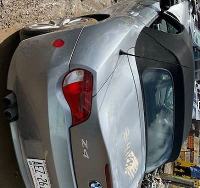 A car that has been smashed in the back of it.