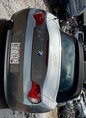 A car that is parked in the street.