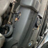 A close up of the engine cover on an older car
