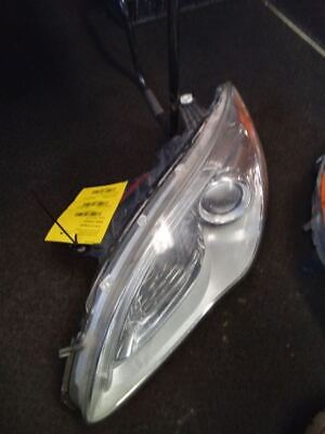 A car headlight with the lights on.