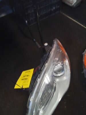 A car headlight with the yellow tag on it.