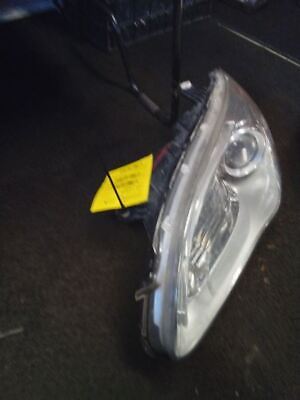 A car headlight with the yellow tag on it.